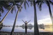  ?? BRUCE R. BENNETT / THE PALM BEACH POST 2016 ?? Mia Munroe of Jupiter exercises in Palm Beach as the sun sets Aug. 10. Photograph­er Bruce R. Bennett placed third in feature photograph­y at the Green Eyeshade Awards.