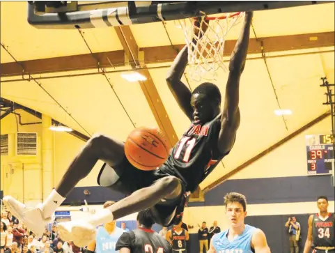  ?? Putnam Science Academy / Contribute­d photo ?? Putnam Science Academy’s Akok Akok, a 6-foot-10 4-star forward, is emerging as a top prospect and drawing a lot of attention from UConn.