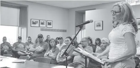  ?? [LIZ BEVAN / THE OBSERVER] ?? Wellesley resident Tara Schneider addresses council at a public meeting on Tuesday night, outlining her concerns with the wording in the draft bylaw governing food trucks in the township.