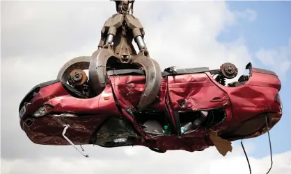  ?? Photograph: Newscast Online Limited/Alamy Stock Photo/Alamy Stock Photo ?? An old Nissan car being scrapped at a British scrapyard. The OECD warned the Conservati­ve party threat to leave the EU without a deal would significan­tly harm the UK economy.