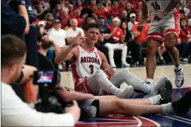  ?? RICK SCUTERI — THE ASSOCIATED PRESS ?? Arizona guard Pelle Larsson (3) reacts after getting fouled during the second half of an NCAA college basketball game against Washington, Saturday, Feb. 24, 2024, in Tucson, Ariz.