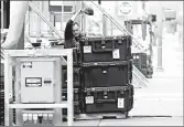  ?? ROSS D. FRANKLIN/AP ?? A worker packs up a stage at the Phoenix venue where Sunday’s Democratic debate was first set to take place.