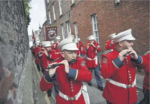  ?? ?? The Apprentice Boys of Derry take part in the annual Relief of Londonderr­y march in Northern Ireland. William Moore, General Secretary of Apprentice Boys, said the Inverness parades had been running for 15 years without incident