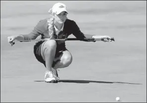  ?? Arkansas Democrat-gazette/jason IVESTER ?? Arkansas’ Emma Lavy studies a putt on the fourth green during the SEC Championsh­ips at The Blessings Golf Club on Saturday. Lavy shot an even-par 72 to finish with a 1-over-par 145. She is in third place and sits three shots back of Auburn’s Patricia...