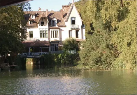  ?? JANET PODOLAK — THE NEWS-HERALD ?? Le Moulin de Connelles, in a 300-year-old mill on a private island in the Seine River, is best approached by water.