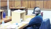  ?? PICTURE: GABI FALANGA ?? FULL OF BRAVADO: Patrick Wisani sits where his lawyer would normally sit, instead of in the dock, after he told the court he would conduct his own defence in his murder trial.