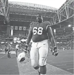  ?? ?? Cardinals offensive lineman Kelvin Beachum walks off the field after their 25-24 loss to the Chargers at State Farm Stadium.