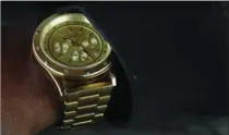  ??  ?? Hall’s gold Flud watch.