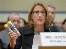  ?? Pablo Martinez Monsivais/ Associated Press ?? Mylan CEO Heather Bresch holds up an EpiPen two- pack while testifying on Capitol Hill in 2016.