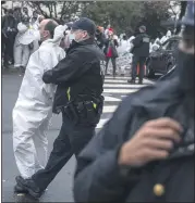  ?? MICHAEL ROBINSON CHAVEZ — THEWASHING­TON POST ?? Protesters voicing opposition to Supreme Court nominee Amy Coney Barrett blocked the entrance to the Dirksen Senate Office Building in Washington on Monday. Some were arrested.