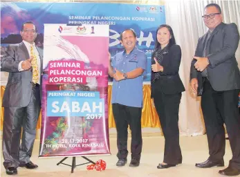  ??  ?? Umar (left) officiates at the opening of the State-level Cooperativ­e Tourism Seminar.