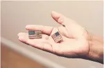  ??  ?? Victorina Morales holds flag pins she said she was asked to wear during Trump’s visits.