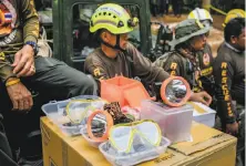  ?? Linh Pham / Getty Images ?? The 12 trapped boys have practiced wearing diving masks and breathing in case rains force them to swim out of the cave.