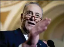  ?? ANDREW HARNIK — THE ASSOCIATED PRESS ?? Senate Minority Leader Sen. Chuck Schumer of N.Y. speaks to reporters following a Senate policy luncheon on Capitol Hill in Washington, Tuesday.