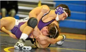  ??  ?? Phoenixvil­le’s D.J. Brock pins Pope John Paul II’s Vinnie Togno in the 145 match.