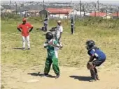  ?? Picture:SUPPLIED ?? BATTER UP: Sakhile Senior Primary School (green) playing against Siyavuya Senior Primary (blue) at the the Mongezi Mali Baseball Tournament in Mdantsane