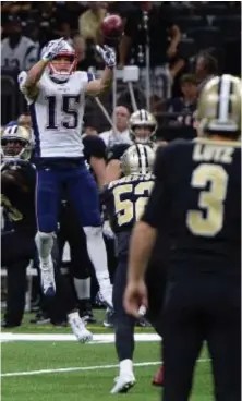  ?? STAFF PHOTO BY CHRISTOPHE­R EVANS ?? WHAT A HAUL: Patriots receiver Chris Hogan (15) prepares to secure an onside kick attempt during the fourth quarter of yesterday’s win in New Orleans.