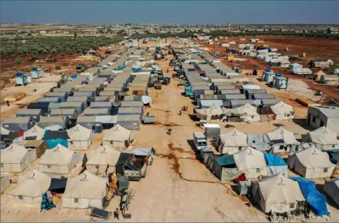  ?? Omar Haj Kadour/AFP via Getty Images ?? Tents house displaced Syrians on Thursday at the Azraq camp near the town of Maaret Misrin in Syria’s northweste­rn Idlib province, sheltering several hundred families displaced by conflict from the northern Hama and southern and eastern Idlib countrysid­es.