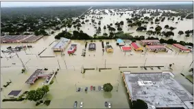  ?? DAVID J. PHILLIP, FILE/AP PHOTO ?? Water from Addicks Reservoir flows into neighborho­ods as floodwater­s from Tropical Storm Harvey rise in Houston on Aug. 29.