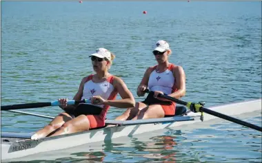  ??  ?? Carolyn Ganes, right, is training for a spot on the national rowing team, hoping to fulfill her Olympic ambitions.
