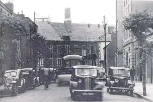  ??  ?? Constructi­on work being carried out at County Hall in the 1940s, seen from Spilman Street. The old prison which was on the site had been demolished, and County Hall would eventually open in 1956.