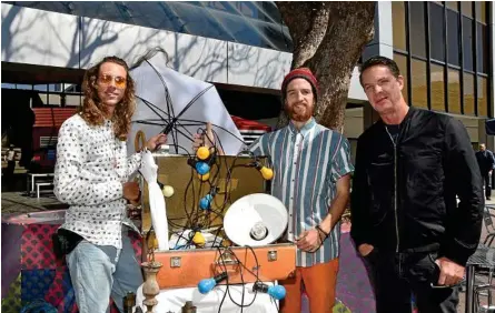  ?? Photo: Bev Lacey ?? LET THERE BE LIGHT: Guest artists for Toowoomba’s inaugural LIT Festival (from left) Jesse Wright, Connor Quill and Craig Walsh get the feel of the Bell St Mall during a mini-launch of the festival which is to be held on September 28 and 29.