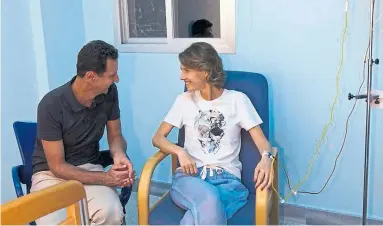  ?? FACEBOOK PAGE OF THE SYRIAN PRESIDENCY VIA THE ASSOCIATED PRESS ?? Syria’s presidency posted on its Facebook page a photo of Syrian President Bashar Assad with his wife in a hospital room.