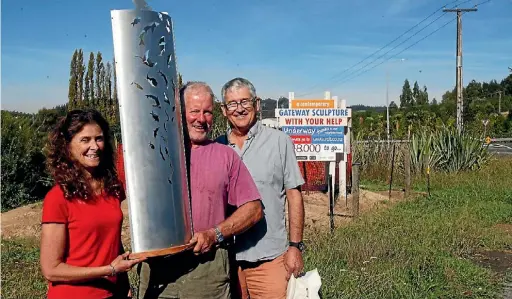  ?? CHERIE SIVIGNON/ STUFF ?? Trustees of the Ruby Coast Initiative Trust Janet Taylor, David Short and Neil Bruce-Miller with a mini version of the Mapua Gateway Sculpture last March when the fundraisin­g target was at $48,000.