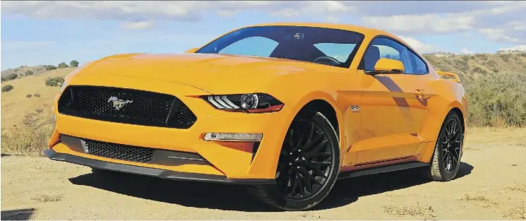  ?? GRAEME FLETCHER/DRIVING.CA ?? The 2018 Ford Mustang GT coupe starts at $39,988 and the GT convertibl­e at $52,738. The GT’s 5.0-L V-8 has been reworked.