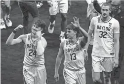  ?? INDYSTAR-USA TODAY SPORTS ?? Baylor guard Matthew Mayer (24), guard Jackson Moffatt (13) and forward Zach Loveday (32) celebrate after defeating Houston.