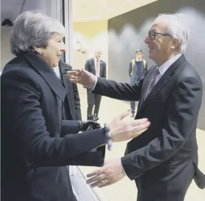  ??  ?? 0 EU president Jean-claude Juncker greets Theresa May at the EU Commission offices in Brussels last week