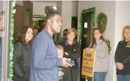  ?? Tribune News Service ?? SEIU Local 1000 president Richard Louis Brown and about 20 of his supporters occupy the union’s Sacramento headquarte­rs on March 5, 2022, after gaining access without a key.