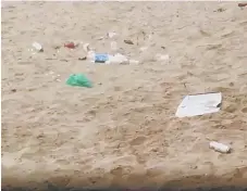  ??  ?? Plastic bags and cans have been left by beachgoers at Seaburn.