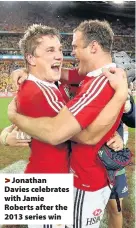  ??  ?? > Jonathan Davies celebrates with Jamie Roberts after the 2013 series win