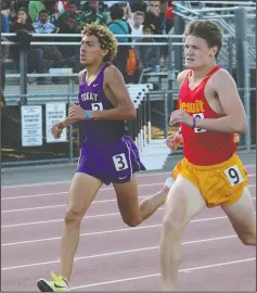  ?? MIKE BUSH/NEWS-SENTINEL ?? Tokay's Andres Sandoval, left, keeps pace in the 1,600 during the SacJoaquin Section Masters Championsh­ips at Elk Grove High School on Friday. Sandoval placed third to advance to the state meet.