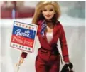  ??  ?? This file photo shows a Barbie doll holding an electoral poster reading "Barbie for President" during the exhibition "Barbie, life of an icon" at the Museum of Decorative Arts in Paris, France, when more than 700 Barbie dolls were displayed from March...
