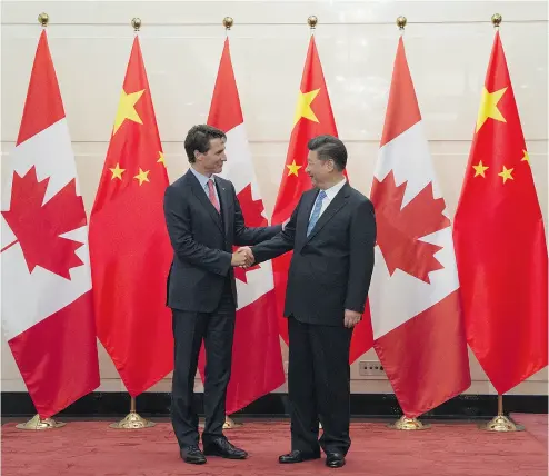  ?? ADRIAN WYLD / THE CANADIAN PRESS ?? Chinese President Xi Jinping welcomes Prime Minister Justin Trudeau in Beijing last year.