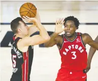  ?? ASHLEY LANDIS-POOL / GETTY IMAGES ?? OG Anunoby of the Toronto Raptors challenges Duncan Robinson of the Miami Heat during NBA play Monday.