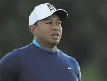  ?? Gregory Bull / Associated Press ?? Tiger Woods, shown during Wednesday’s pro-am event at Torrey Pines, starts his 2018 season on Thursday.