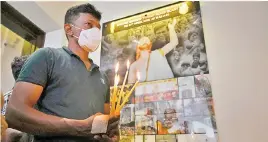  ?? — AFP photo ?? Christian devotees lights candles in remembranc­e of the Easter Sunday attack victims to mark the second anniversar­y of the attacks, in Colombo.