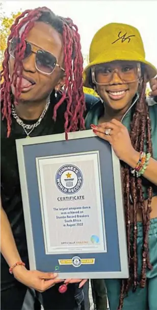  ?? /INSTAGRAM ?? Bontle Modiselle with Alfa Kat holding the Guinnes Book of Records Certificat­e for amapiano dance moves.