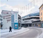  ?? CLARA TUMA/THE NEW YORK TIMES ?? A pedestrian makes his way along a mostly deserted area Jan. 9 in Davos, Switzerlan­d. Davos ditched its annual economic forum again.