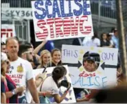  ?? ALEX BRANDON/THE ASSOCIATED PRESS ?? Supporters of House Majority Whip Steve Scalise, R-La., hold signs before the Congressio­nal baseball game.