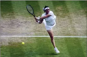  ?? GERALD HERBERT — THE ASSOCIATED PRESS ?? Tunisia’s Ons Jabeur returns to Germany’s Tatjana Maria in a women’s singles semifinal match on day eleven of the Wimbledon tennis championsh­ips in London on Thursday.