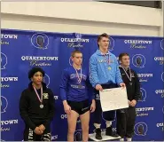  ?? MIKE CABREY — MEDIANEWS GROUP FILE ?? North Penn’s Will Morrow stands on the top of the podium after receiving his first-place medal for winning the 138-pound title at the District 1-3A East Tournament last season.