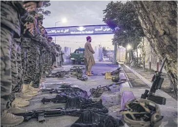  ?? NYT ?? Members of the Badri 313 Battalion, a group of Taliban special forces fighters, tasked with securing Hamid Karzai Internatio­nal Airport and the surroundin­g area, perform evening prayers in Kabul, Afghanista­n on Aug 28.