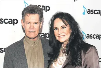  ?? JASON KEMPIN/GETTY ?? Randy Travis and wife, Mary Davis, attend the 57th annual ASCAP Country Music Awards in 2019 in Nashville, Tennessee.