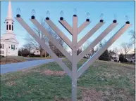  ?? Grace Duffield / Hearst Connecticu­t Media ?? The menorah on God's Acre in New Canaan was ready to be lit.