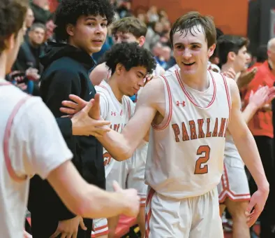  ?? RICK KINTZEL/THE MORNING CALL ?? Parkland’s Nick Coval, shown celebratin­g with teammates after the Trojans beat Garnet Valley on March 15 in the PIAA Class 6A playoffs, would seem a good example of a high school athlete who would benefit from a name, image and likeness deal.