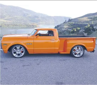  ?? PHOTOS: RON TKACHUK ?? Ron Tkachuk’s 1971 GMC radical custom pickup catches plenty of eyes with its dramatic lines and that tango pearl orange paint job.